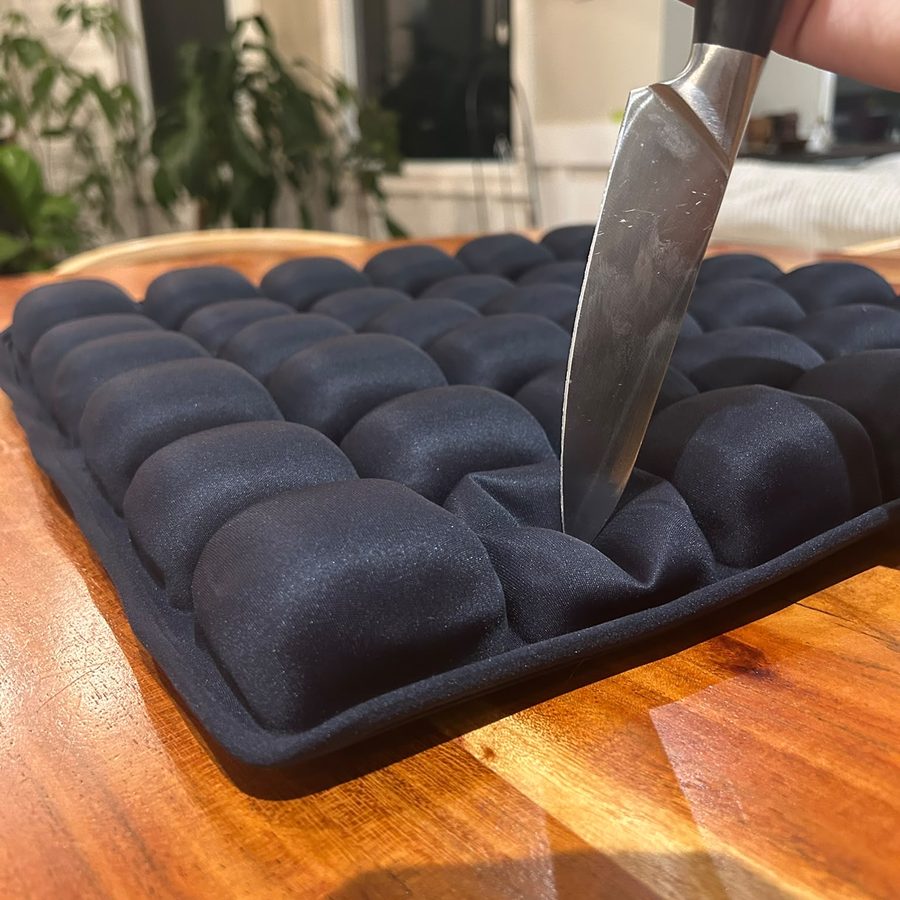 Knife pressed into a Morph air cell without puncturing it